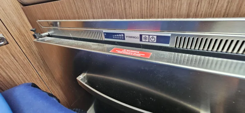 Boondoggle Yacht Photos Pics Built-in appliance on 2022 Beneteau Antares 11 yacht, featuring sleek metallic finish.