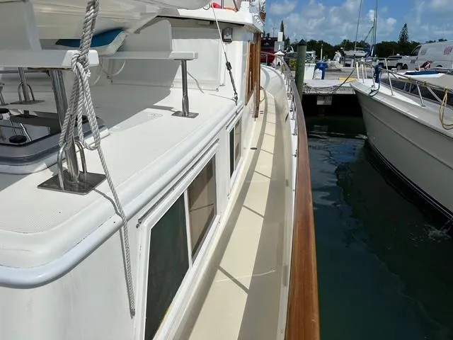 Blue Yacht Photos Pics 1987 Albin Double Cabin boat docked at marina, showcasing side deck and railing.