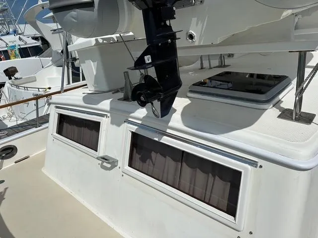 Blue Yacht Photos Pics 1987 Albin Double Cabin boat with visible windows and motor, docked in a marina.