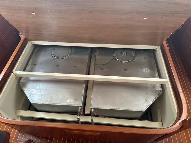 Blue Yacht Photos Pics Fuel tanks inside 1987 Albin Double Cabin boat, under wooden hatch.