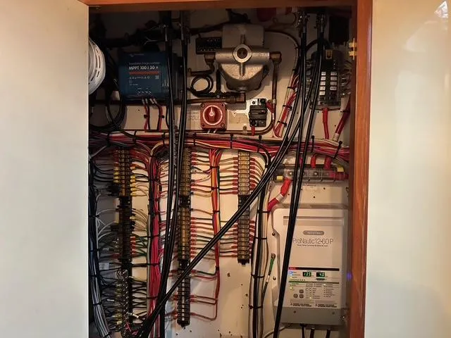Blue Yacht Photos Pics Electrical panel inside a 1987 Albin Double Cabin boat, featuring organized wiring and components.