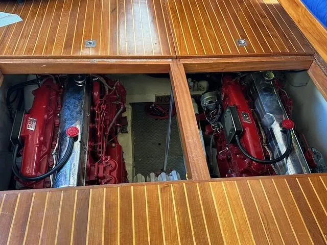 Blue Yacht Photos Pics Engine compartment of a 1987 Albin Double Cabin boat with twin red engines.