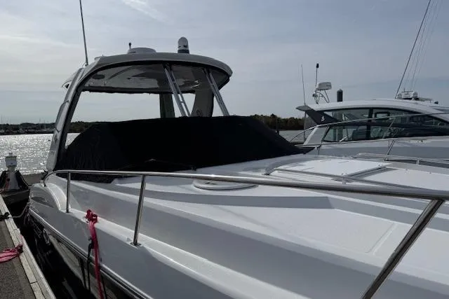  Yacht Photos Pics 2021 Monterey 335 Sport Yacht docked, showcasing sleek design and modern features.