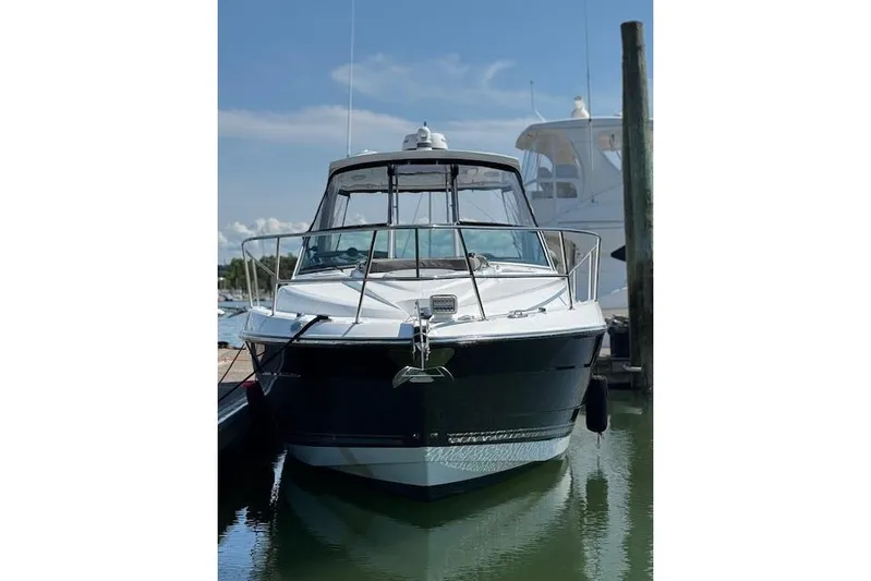  Yacht Photos Pics 2021 Monterey 335 Sport Yacht docked in marina, front view.