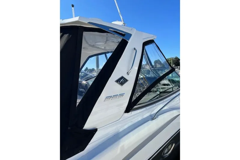  Yacht Photos Pics 2021 Monterey 335 Sport Yacht, sleek design, side view, docked under clear blue sky.