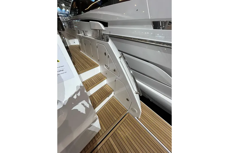  Yacht Photos Pics Staircase on 2024 Azimut Fly 68 yacht with sleek design and wooden finish.