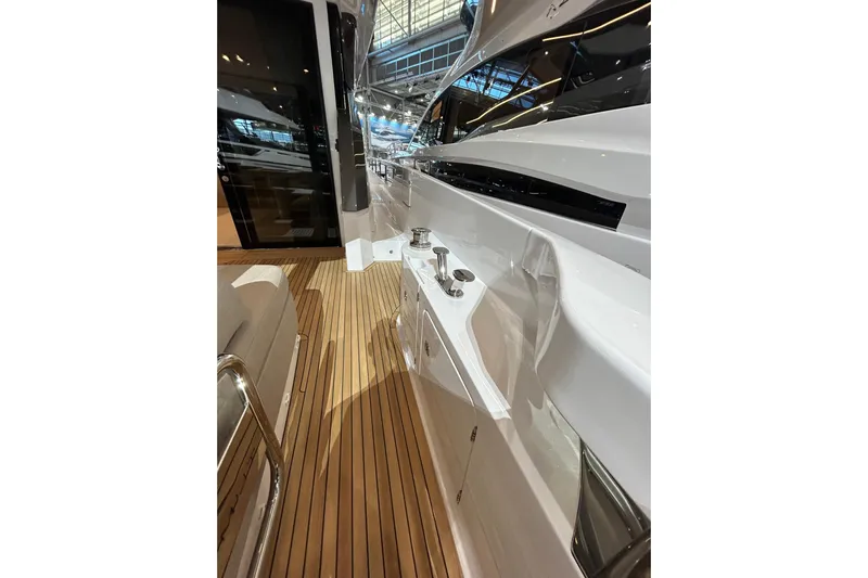  Yacht Photos Pics 2024 Azimut Fly 68 yacht deck with sleek design and wooden flooring.