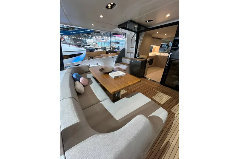  Yacht Photos Pics Luxurious interior of 2024 Azimut Fly 68 yacht with elegant seating and wooden table.