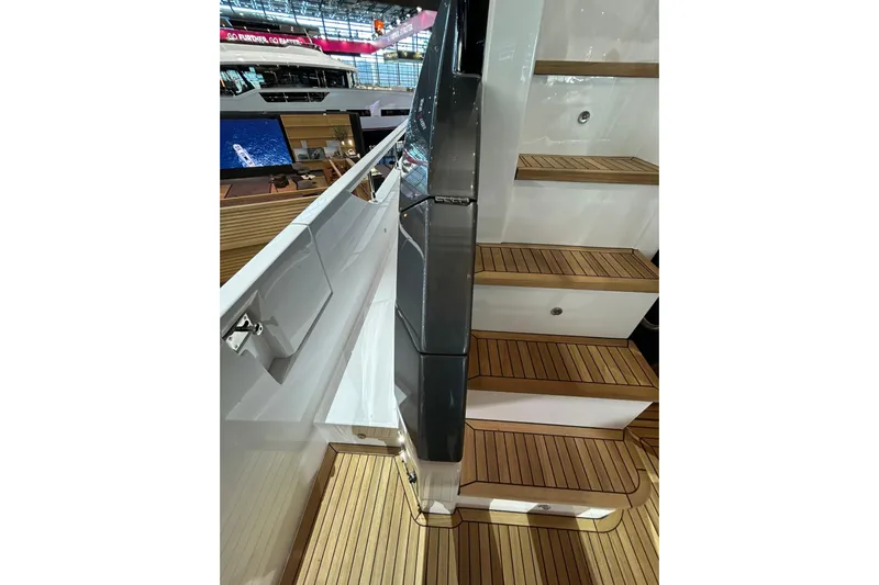  Yacht Photos Pics Staircase on 2024 Azimut Fly 68 yacht with sleek wooden steps and modern design.