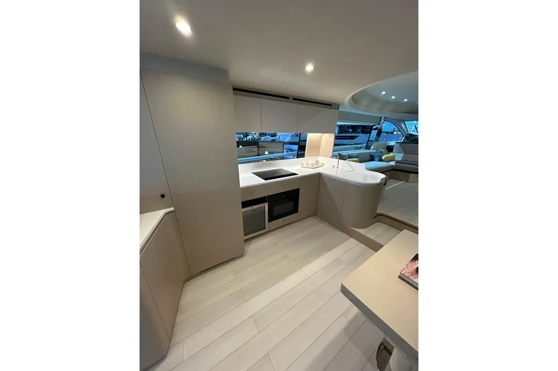  Yacht Photos Pics Luxurious interior of 2024 Azimut Fly 68 yacht with modern kitchen design.