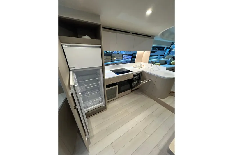  Yacht Photos Pics Luxurious kitchen interior of 2024 Azimut Fly 68 yacht with modern appliances.
