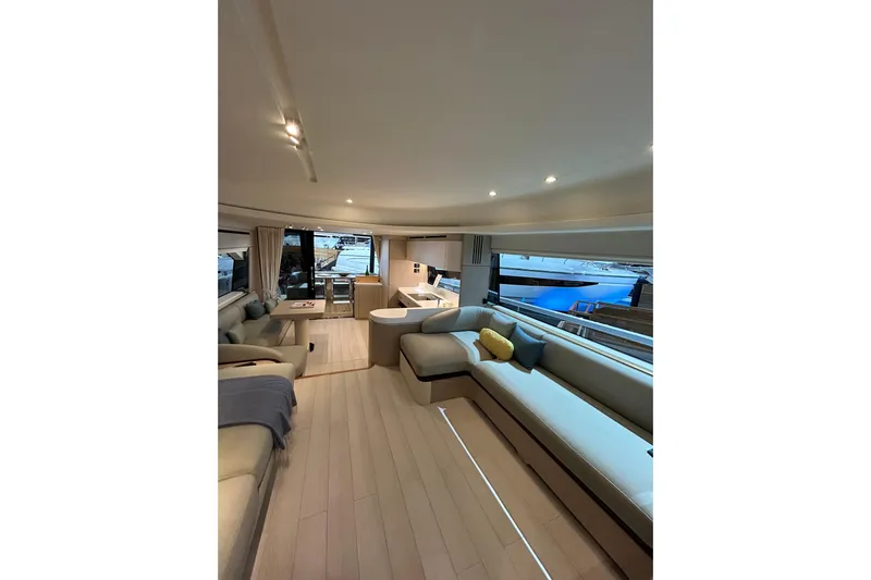  Yacht Photos Pics Luxurious interior of 2024 Azimut Fly 68 yacht with modern seating and large windows.