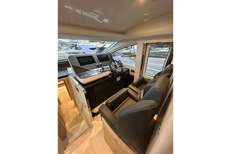  Yacht Photos Pics 2024 Azimut Fly 68 yacht cockpit with modern controls and luxurious seating.