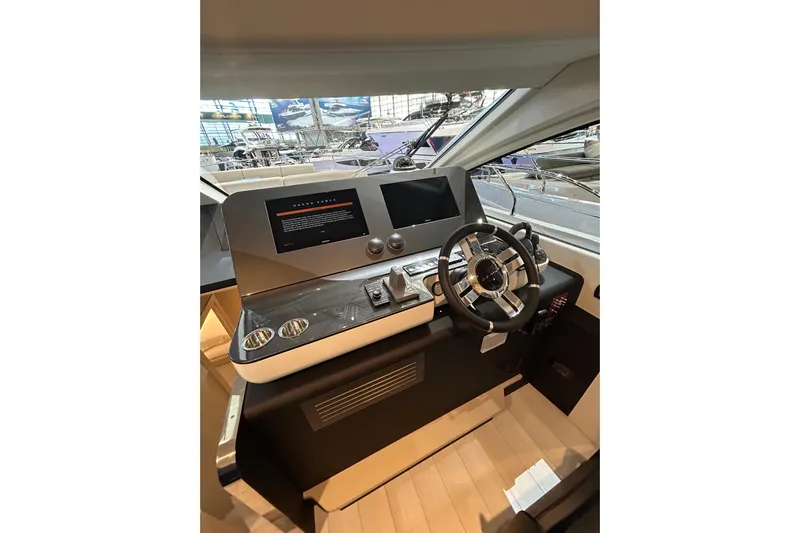  Yacht Photos Pics 2024 Azimut Fly 68 yacht helm with modern controls and sleek design.