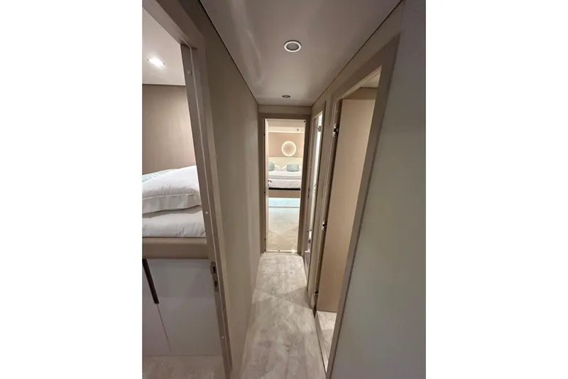  Yacht Photos Pics 2024 Azimut Fly 68 yacht interior hallway with modern design and cozy bedroom view.