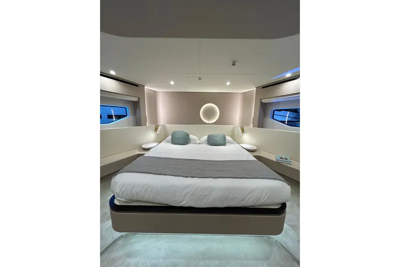  Yacht Photos Pics Luxurious bedroom interior of 2024 Azimut Fly 68 yacht with modern design and ambient lighting.
