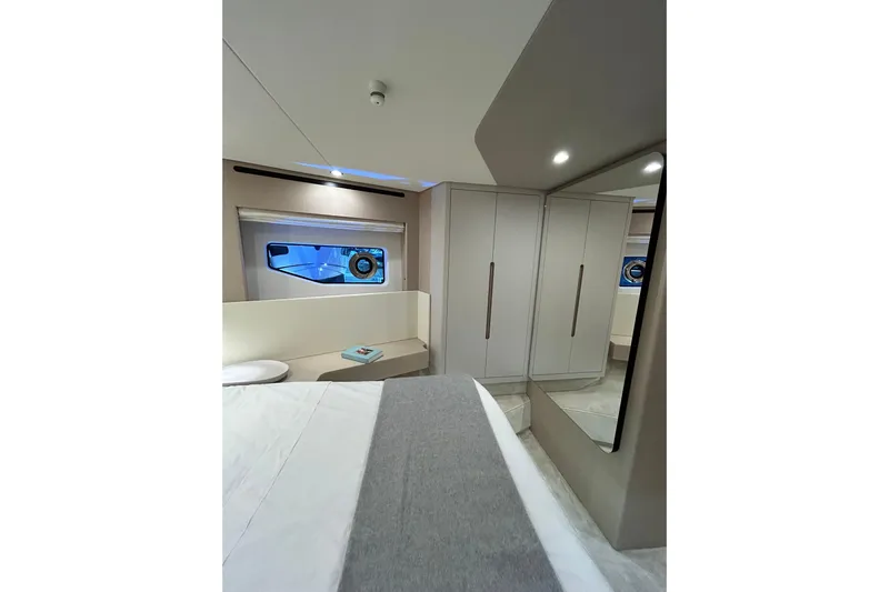  Yacht Photos Pics Luxurious interior of 2024 Azimut Fly 68 yacht bedroom with modern design and elegant furnishings.
