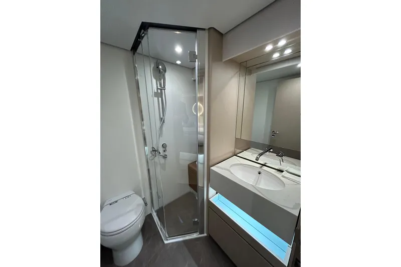  Yacht Photos Pics Luxurious bathroom in 2024 Azimut Fly 68 yacht with modern shower and vanity.