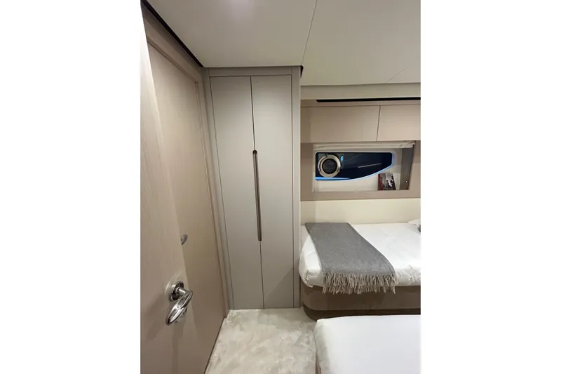  Yacht Photos Pics 2024 Azimut Fly 68 yacht interior cabin with modern design and cozy bedding.