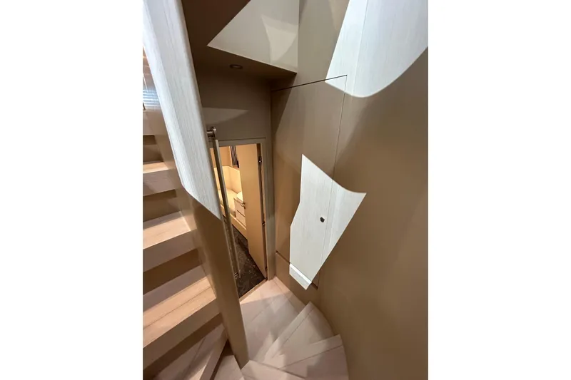  Yacht Photos Pics Interior staircase of 2024 Azimut Fly 68 yacht, featuring modern design and wood accents.