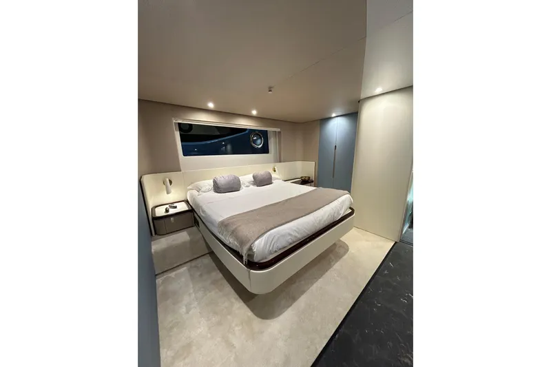  Yacht Photos Pics Luxurious bedroom interior of 2024 Azimut Fly 68 yacht with modern design.