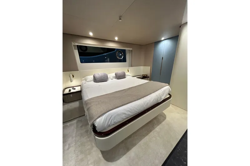  Yacht Photos Pics Luxurious bedroom interior of 2024 Azimut Fly 68 yacht with modern design.