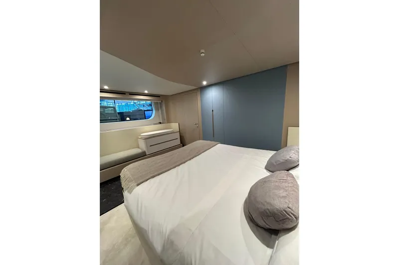  Yacht Photos Pics Luxurious bedroom interior of 2024 Azimut Fly 68 yacht, featuring modern design and elegant furnishings.