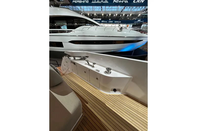  Yacht Photos Pics Luxurious 2024 Azimut Fly 68 yacht with sleek design and wooden deck.