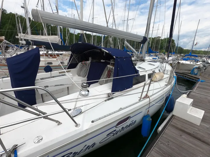 Brisa Surena Yacht Photos Pics Catalina 42 MK11 sailboat docked at marina, 2002 model, with blue covers and white hull.