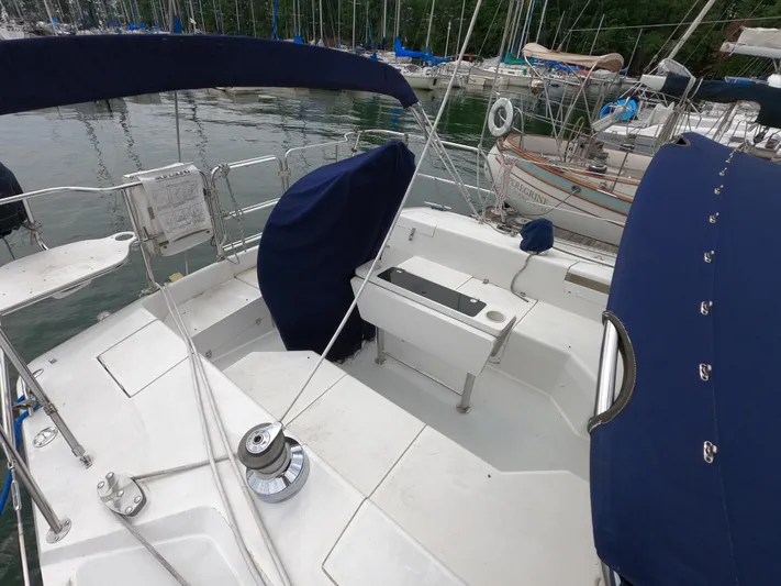 Brisa Surena Yacht Photos Pics 2002 Catalina 42 MKII sailboat cockpit with blue covers, docked in a marina.