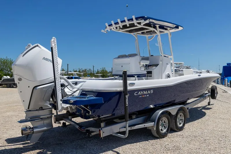  Yacht Photos Pics 2022 Caymas 26 HB boat on trailer, featuring a powerful outboard motor.