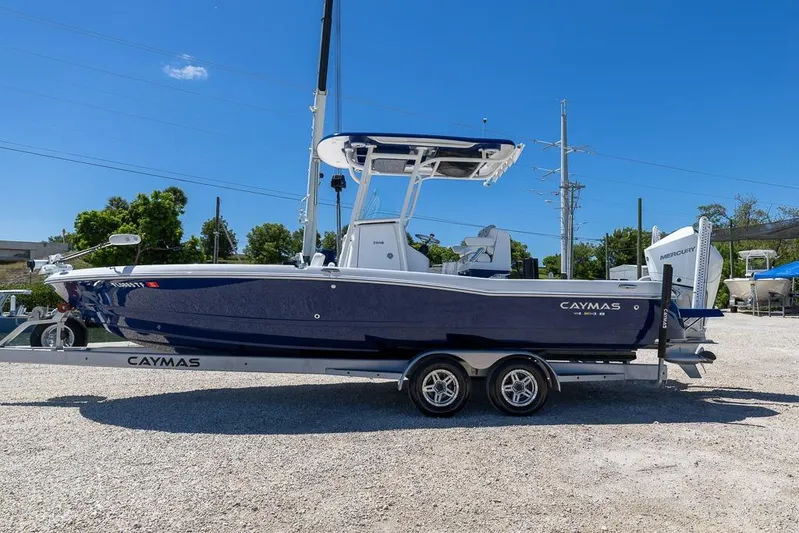  Yacht Photos Pics 2022 Caymas 26 HB boat on trailer under clear blue sky.
