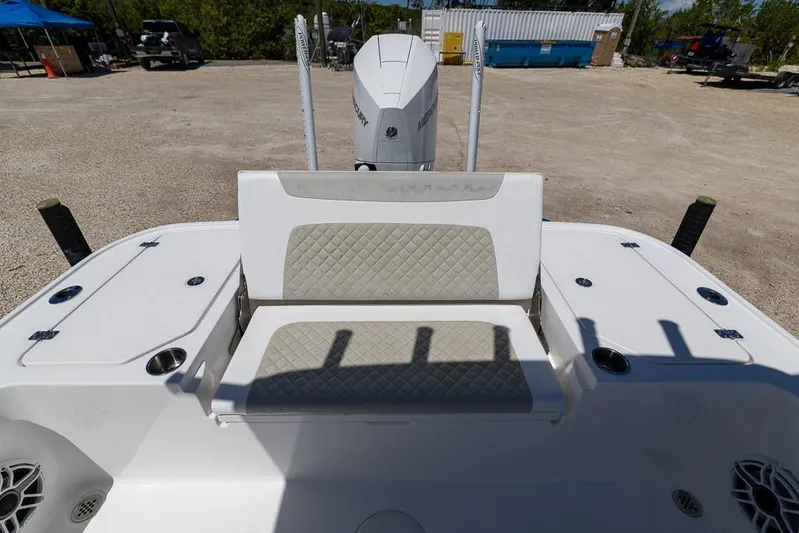  Yacht Photos Pics 2022 Caymas 26 HB boat with cushioned seating and storage compartments.