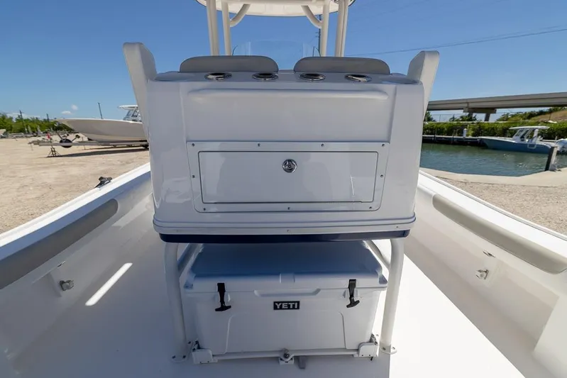  Yacht Photos Pics 2022 Caymas 26 HB boat interior with Yeti cooler and storage compartment.