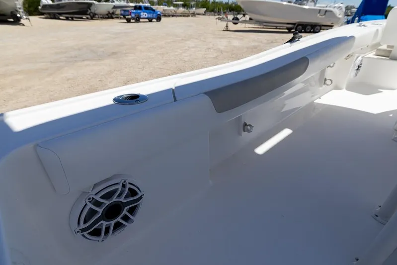  Yacht Photos Pics 2022 Caymas 26 HB boat interior with speaker and rod holder.