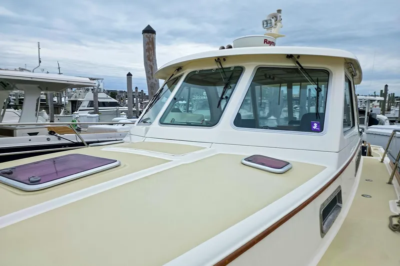  Yacht Photos Pics 2008 Sabre 34 Express boat docked at marina, showcasing cabin and deck features.