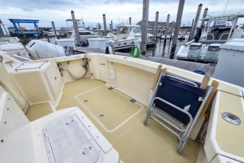  Yacht Photos Pics 2008 Sabre 34 Express boat deck at marina with docked yachts in background.