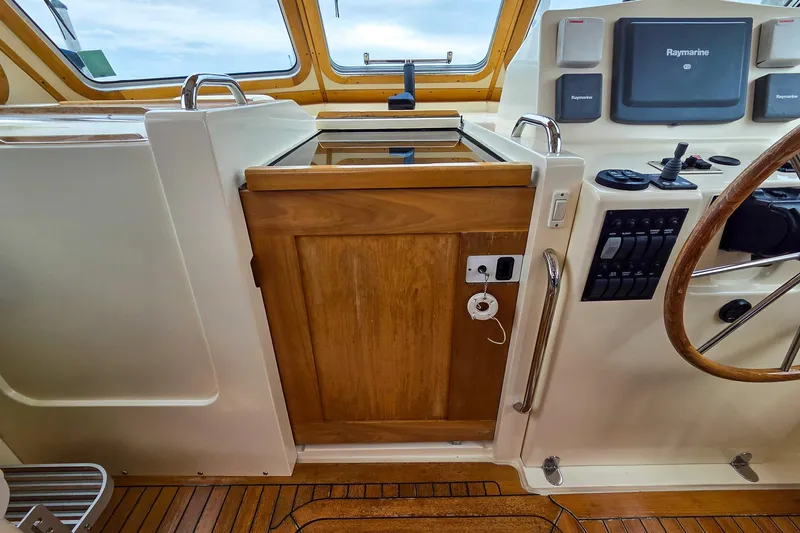  Yacht Photos Pics 2008 Sabre 34 Express helm with Raymarine electronics and wooden accents.