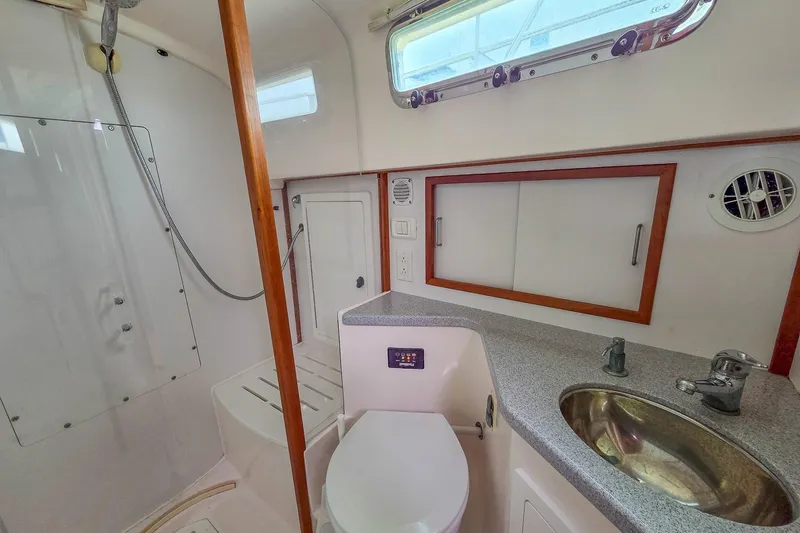  Yacht Photos Pics 2008 Sabre 34 Express yacht bathroom with shower, sink, and toilet.