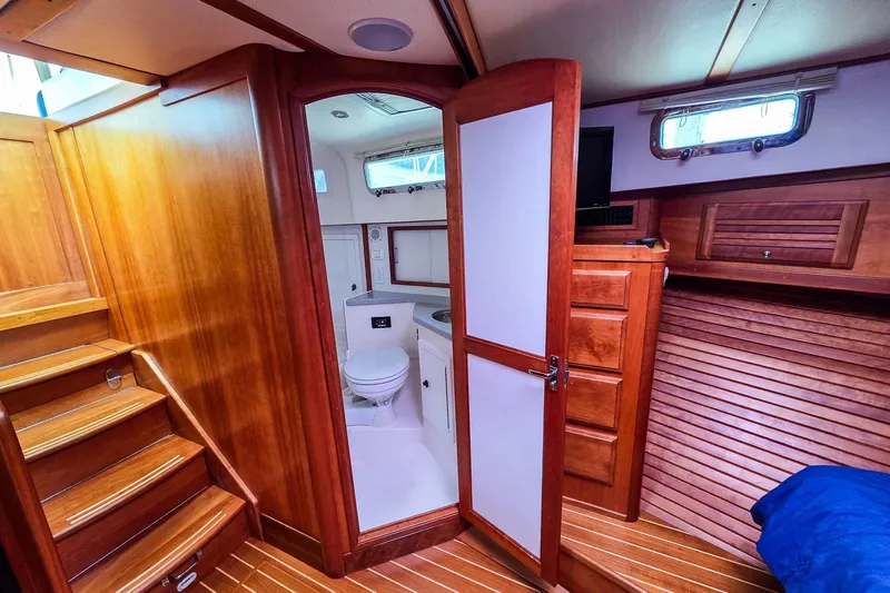  Yacht Photos Pics Interior of 2008 Sabre 34 Express yacht with wooden cabinetry and compact bathroom.
