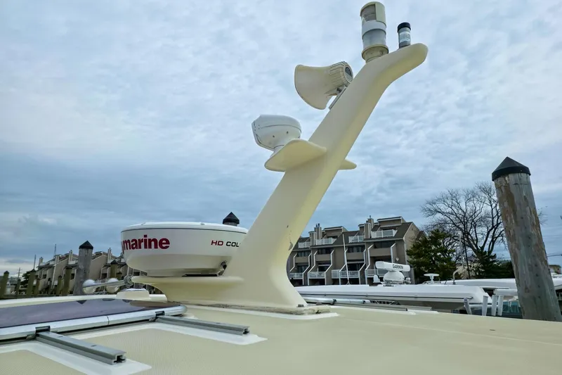  Yacht Photos Pics 2008 Sabre 34 Express boat radar and antenna setup against cloudy sky.