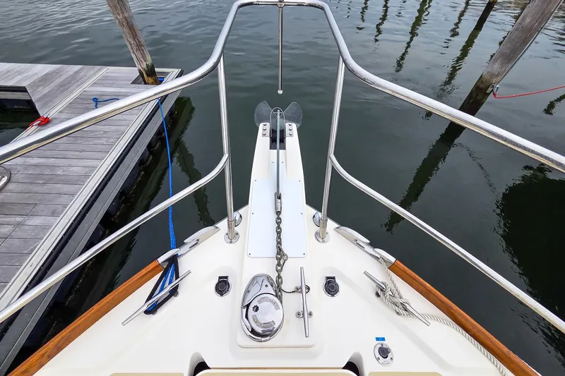  Yacht Photos Pics Bow view of 2008 Sabre 34 Express yacht at dock, featuring anchor and railing.