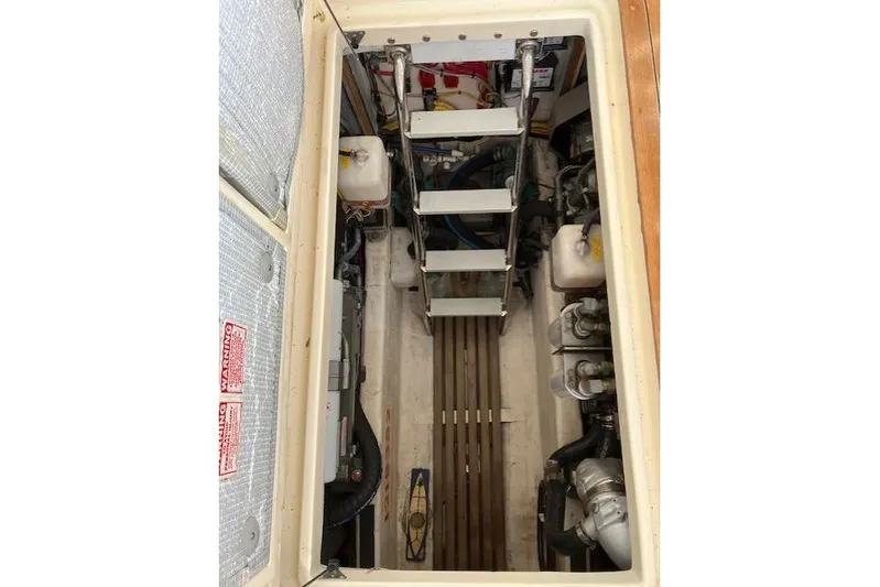  Yacht Photos Pics Engine compartment of 2008 Sabre 34 Express boat, showing mechanical components and access ladder.