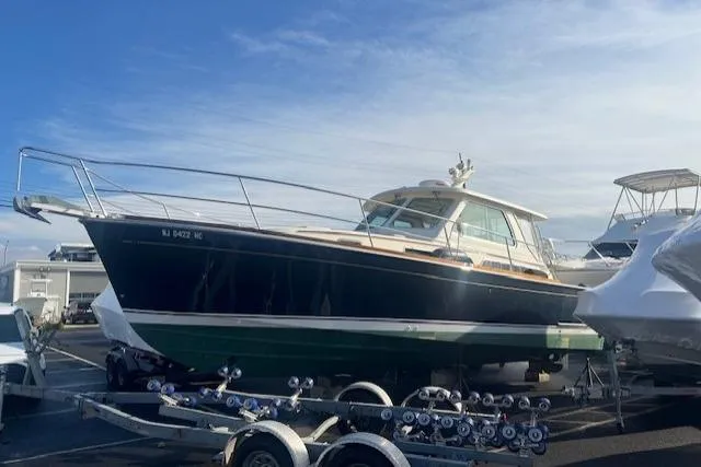 Yacht Photos Pics 2008 Sabre 34 Express boat on trailer under clear sky.