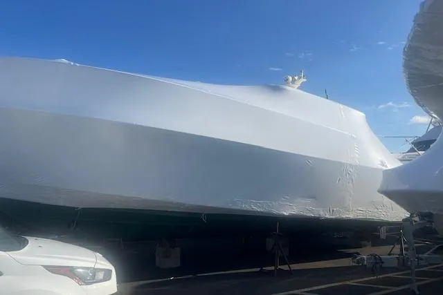  Yacht Photos Pics 2008 Sabre 34 Express boat covered in protective wrap at a marina.