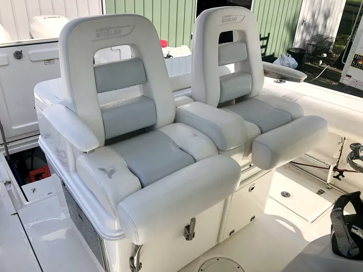 Yacht Photos Pics 2016 Boston Whaler OUTRAGE boat seats, white and gray, in a clean, modern design.