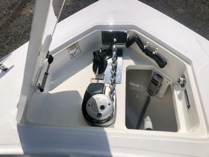  Yacht Photos Pics 2016 Boston Whaler OUTRAGE anchor compartment with chain and winch system.