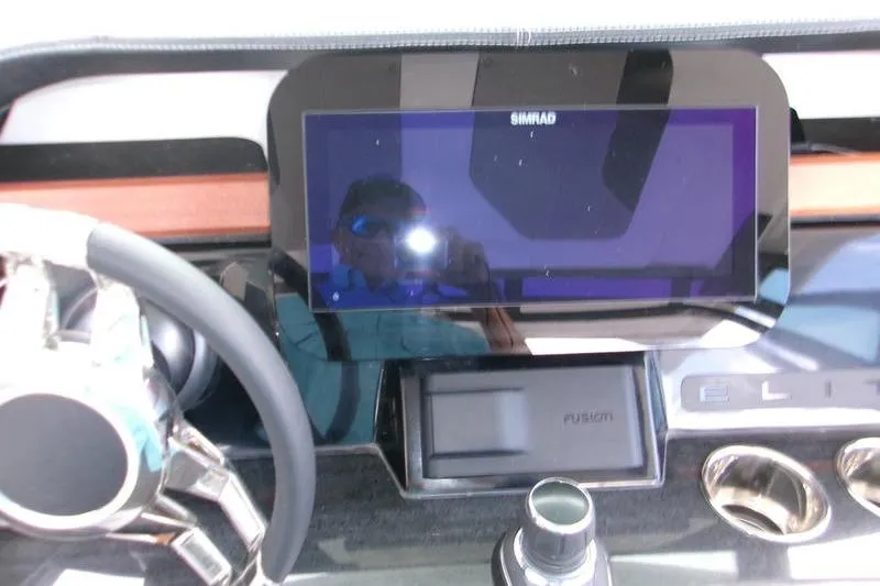  Yacht Photos Pics Dashboard of 2026 Monterey Elite 30 OB with Simrad display and steering wheel.