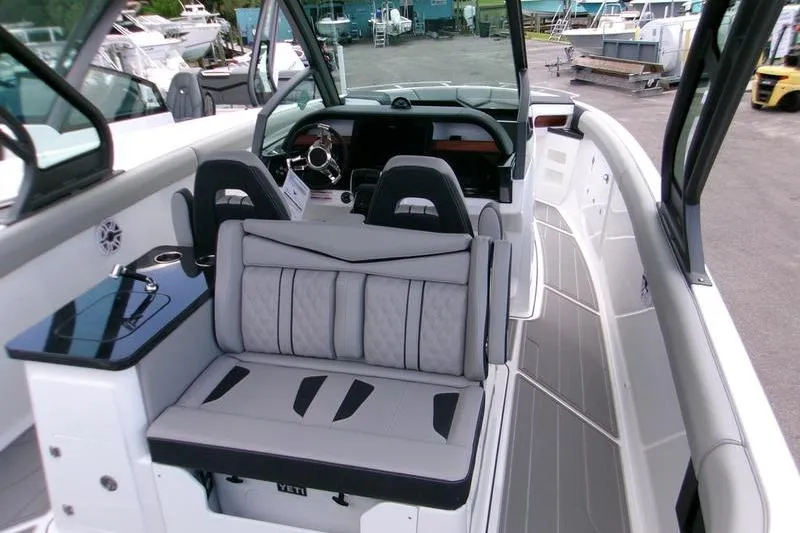  Yacht Photos Pics 2026 Monterey Elite 30 OB boat interior with modern seating and sleek dashboard design.