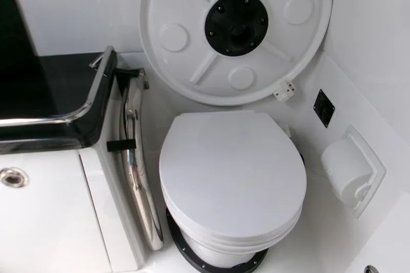  Yacht Photos Pics 2026 Monterey Elite 30 OB boat bathroom with modern toilet and sleek design.